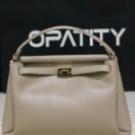 JW PEI Carmen Top Handle Bag in the color Apricot.