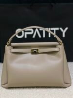 JW PEI Carmen Top Handle Bag in the color Apricot.