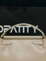 JW PEI Carmen Top Handle Bag in the color Apricot. - Image 2