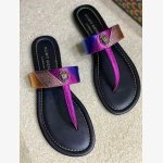 Kurt Geiger London Kensington T-Bar Sandal, a signature style known for its vibrant metallic design and iconic embellishments.