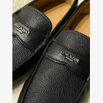 Prada black Pebbled Leather Loafers featuring a brand signature logo on gunmetal-tone hardware. - Image 6
