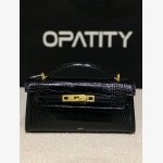 black crocodile-embossed handbag from the brand JW PEI It features a classic structured silhouette with a croc-embossed texture and sleek gold-tone hardware.