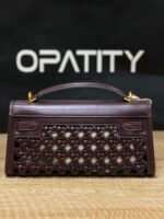 JW PEI Noor Top Handle Bag in dark red is a vegan leather bag featuring gold hardware and a woven design. - Image 2