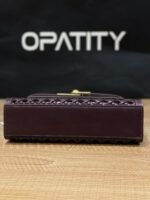 JW PEI Noor Top Handle Bag in dark red is a vegan leather bag featuring gold hardware and a woven design. - Image 5