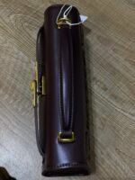 JW PEI Noor Top Handle Bag in dark red is a vegan leather bag featuring gold hardware and a woven design. - Image 4