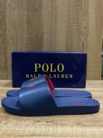 Polo Ralph Lauren Cayson Slides in a classic navy blue and red colorway. These lightweight pool slides are crafted with a synthetic leather upper strap lined with soft, cushioned fabric for comfortable wear. - Image 5