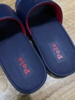 Polo Ralph Lauren Cayson Slides in a classic navy blue and red colorway. These lightweight pool slides are crafted with a synthetic leather upper strap lined with soft, cushioned fabric for comfortable wear. - Image 3