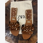 CROSSOVER LEATHER SANDALS WITH SHEEPSKIN